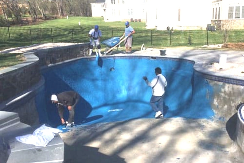 a man doing a trick on a skateboard at a skate park